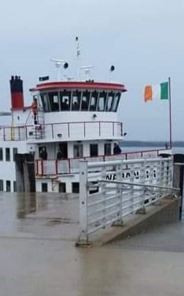 The Irish flag flies on dock in Long Island Maine.